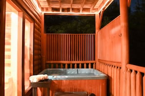 Hot tub at night with rope lighting. So cozy and inviting.