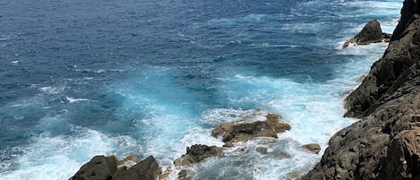 Tidal pool at base of cliff, facing Thatch Cay (north east).