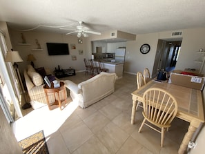 Large open living space with full sliding doors to the beautiful Gulf views