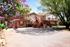 From of House #2 Is located on the ground floor underneath the steps.