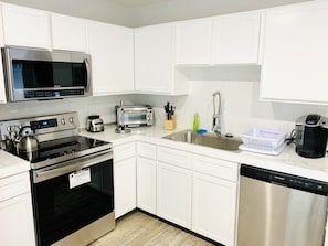 Kitchen is full with amenities 