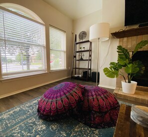 Big windows let in lots of natural light as you lounge on fluffy floor cushions