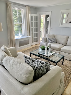 Living room opens to the dining room and kitchen. 