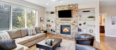 Beautiful main living area with mountain views  and a custom gas fireplace.