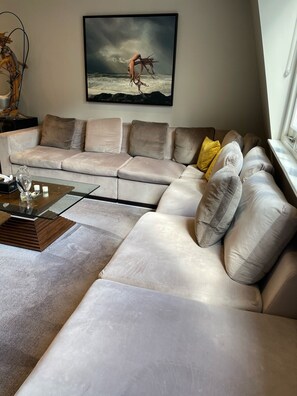 Sit back and relax on this Harrods designer sofa. 