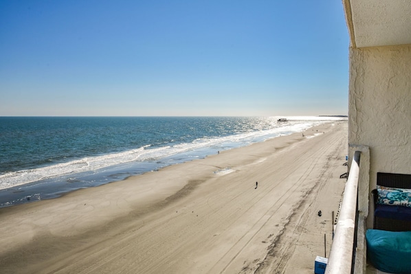 This condo has a balcony overlooking the beach and the Garden City Pier.