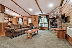 Living Area with Smart TV, Fireplace, and Queen Sleeper Sofa