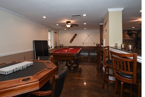 Pool, ping pong, shuffleboard, darts, poker table. Perfect for a game night! 