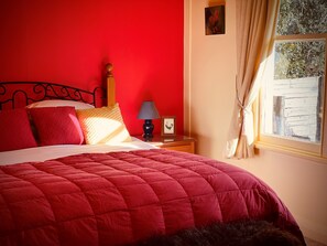 Main bedroom for you at kekerengu cottage with a king size bed.