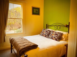 Green bedroom with queen size bed