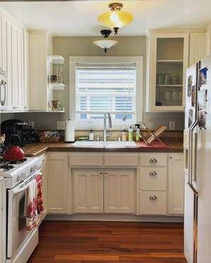 Fully stocked kitchen with everything you need to make or enjoy a meal. 