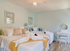 Blue bedroom with 1 queen bed and 1 twin bed