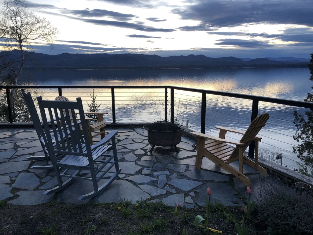 Chairs around a portable firepit at a popular lakefront Vermont vacation rental.