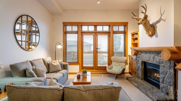 Main Floor - Living Room With Gas Fireplace & Queen Sofabed