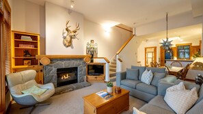 Main Floor - Living Room With Gas Fireplace & Queen Sofabed