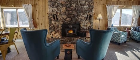 A cozy place to relax in front of wood burning stove. We provide fire supplies.