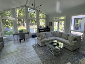 family room with desk and large new smart TV and super comfortable new couch! 