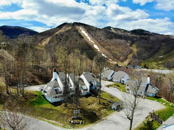 Home surrounded by majestic mountains.