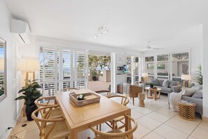 Beach views from open plan living, dining and kitchen