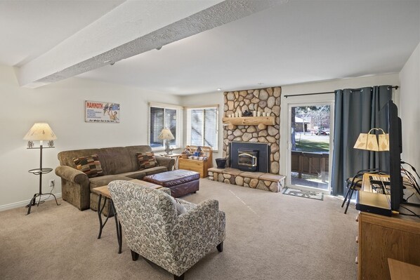 Spacious Living Room with a pellet stove, access to the deck