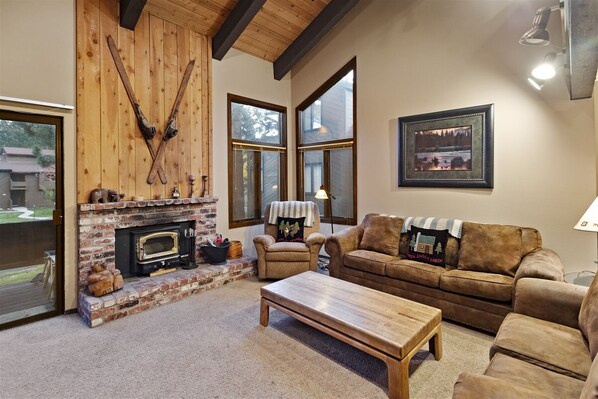 Living Room with a wood buring stove, access to deck