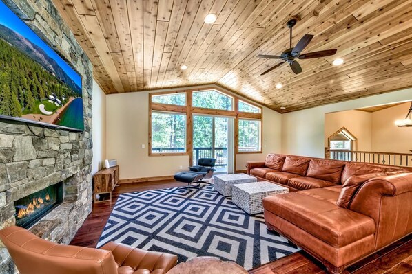 Natural light streams into the living area through the picture window with sliders to the front balcony.