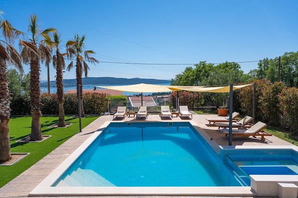 Nestled in Kaštel Sućurac on a generous 1130 sqm plot, this villa boasts 240 sqm of elegantly decorated interior space.