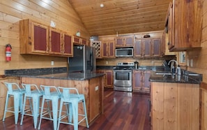 Prepare meals in the comfort of the fully equipped kitchen with attached dining area. The fridge/freezer do not provide filtered water and ice.