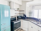 Beautiful kitchen with a vintage turquoise fridge and new appliances… 👩‍🍳
