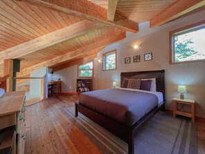 Loft queen bedroom with natural light