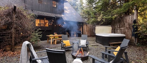 Fire pit with a private hot tub and seating