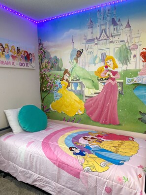 Princess room with two twin beds and a pull out twin bed.