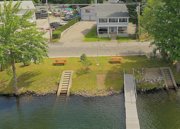 House and waterfront yard with dock