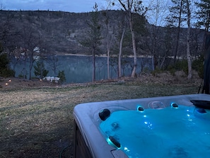 Our large 7 person hot tub overlooking the lake.