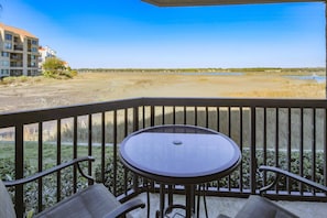 201 Captains Quarters features stunning views of the marsh and Broad Creek.