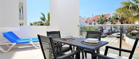 Large balcony with extra dining area outside for four guests