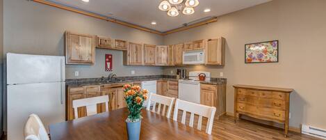The large kitchen is well stocked with cooking and dining essentials and seats up to 10 guests.