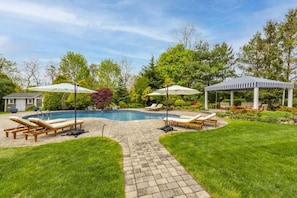 Backyard w/ mineral spring pool, covered cabana, outdoor shower.