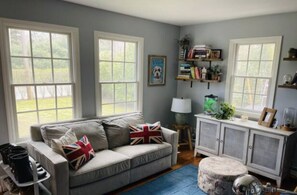 first floor den / secondary living room with pull-out Queen sofabed.