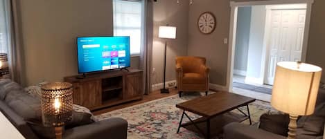 Living room with 50" Roku TV.