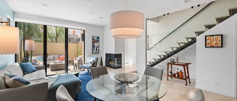 LaMirage features a bright and light-filled open concept living space, a private courtyard with fire pit, and a mid-century inspired floating staircase leading to the bedrooms on the second floor.