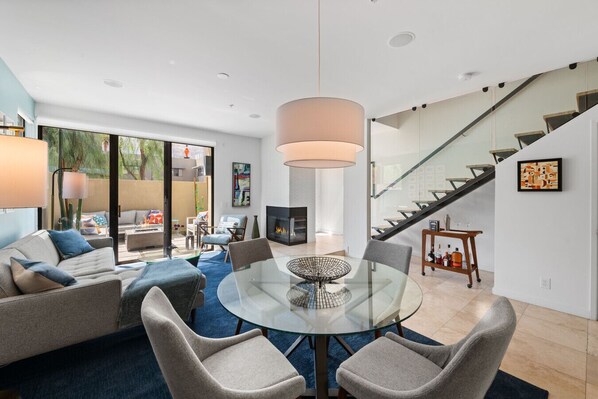LaMirage features a bright and light-filled open concept living space, a private courtyard with fire pit, and a mid-century inspired floating staircase leading to the bedrooms on the second floor.