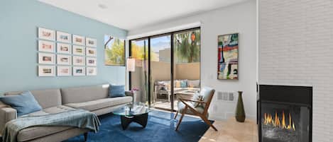 Bright and thoughtfully designed, featuring a cozy fireplace and plush sofa — perfect for relaxing after a day out.