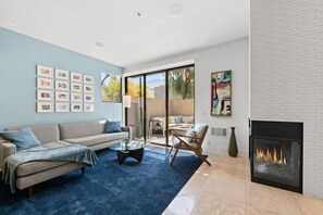 Bright and thoughtfully designed, featuring a cozy fireplace and plush sofa — perfect for relaxing after a day out.