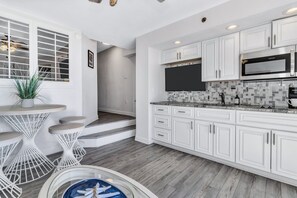 - Fuel your adventures with breakfast at this chic bistro style dining nook - Cook with ease in a sleek, fully equipped stocked kitchen, perfect for any craving - Beach days start and end here, where good food and great vibes come together