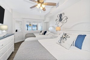 - Drift into comfort in a charming bedroom with soft linens & ocean inspired decor - Two cozy queen size beds make this space perfect for families or friends to unwind together - Sleep peacefully & wake up refreshed, ready for another beach day ahead