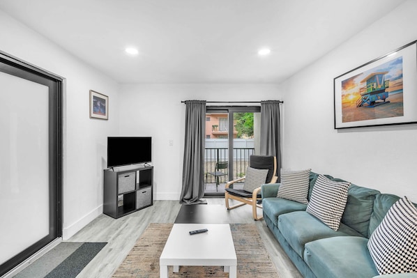 Enjoy your favorite shows and movies, or unwind in the roomy living area featuring comfortable seating and a large, streaming-ready widescreen TV.
