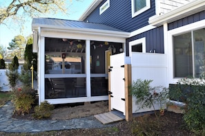 Rinse the sand off when returning from the beach in this enclosed outdoor shower!