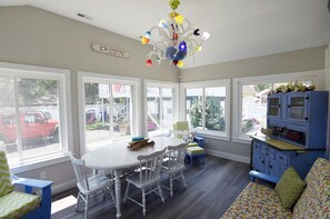 Sun Room w/ Extra Dining. Check out the custom chandelier!
