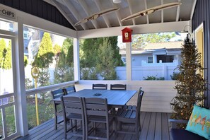 Enjoy dinner on the screened porch.